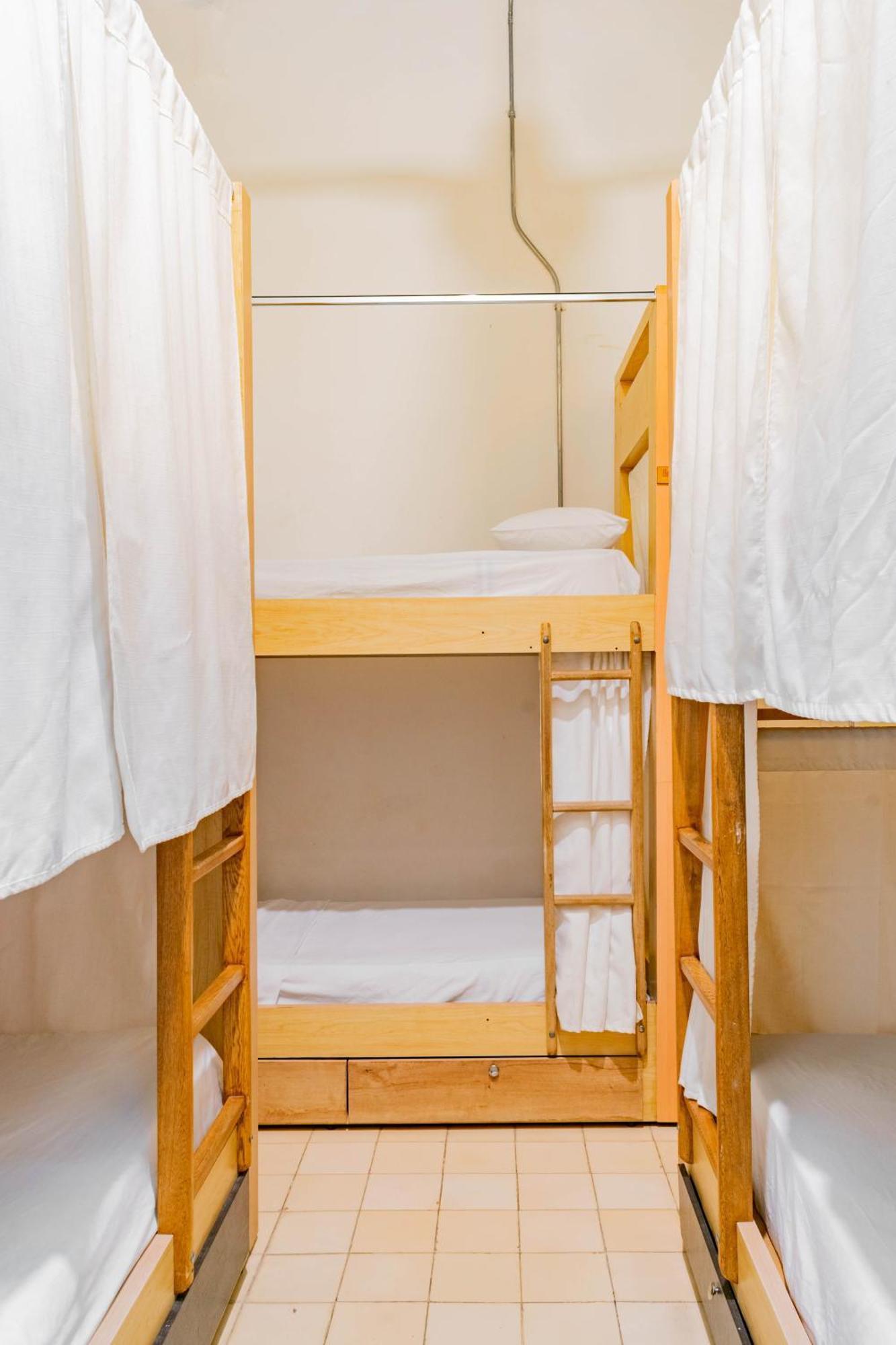 Cama en habitación compartida de 6 camas